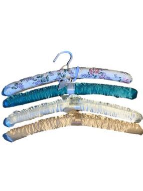 Four fabric covered hangers